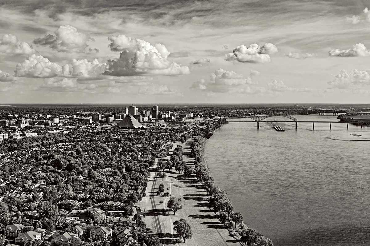 Looking downriver at Greenbelt Park along the riverside, the Memphis Pyramid and downtown, and the Hernando de Soto (I–40) and (top right) Memphis-Arkansas (I–55) Bridges, Memphis, TN.